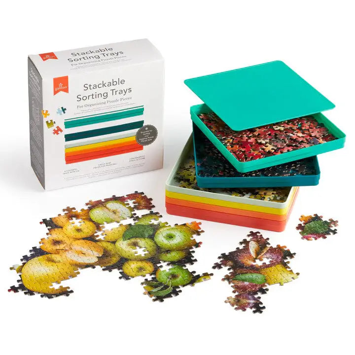 Stackable sorting trays with puzzle pieces and packaging on a white background