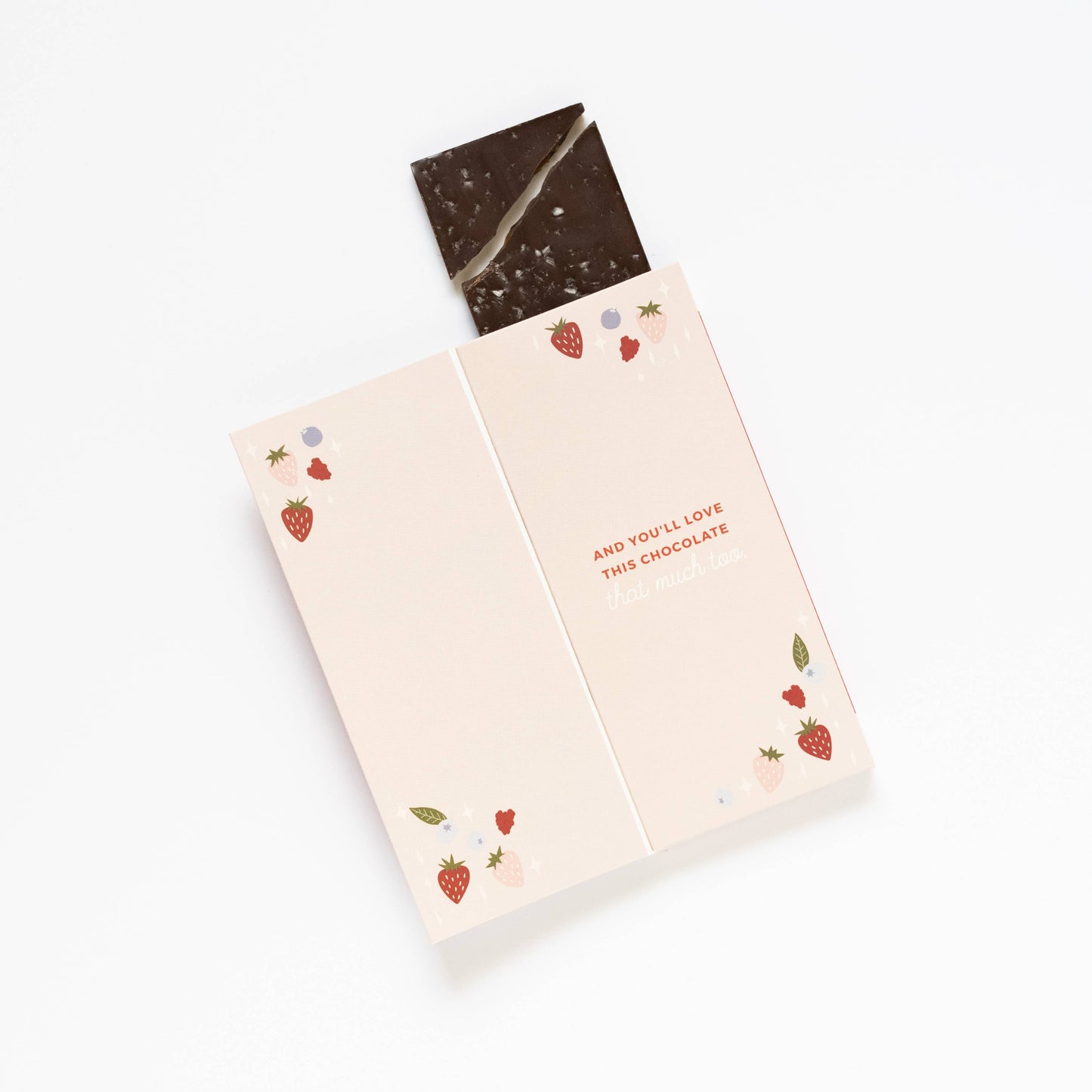 Chocolate bar with a decorative paper wrapper on a white background