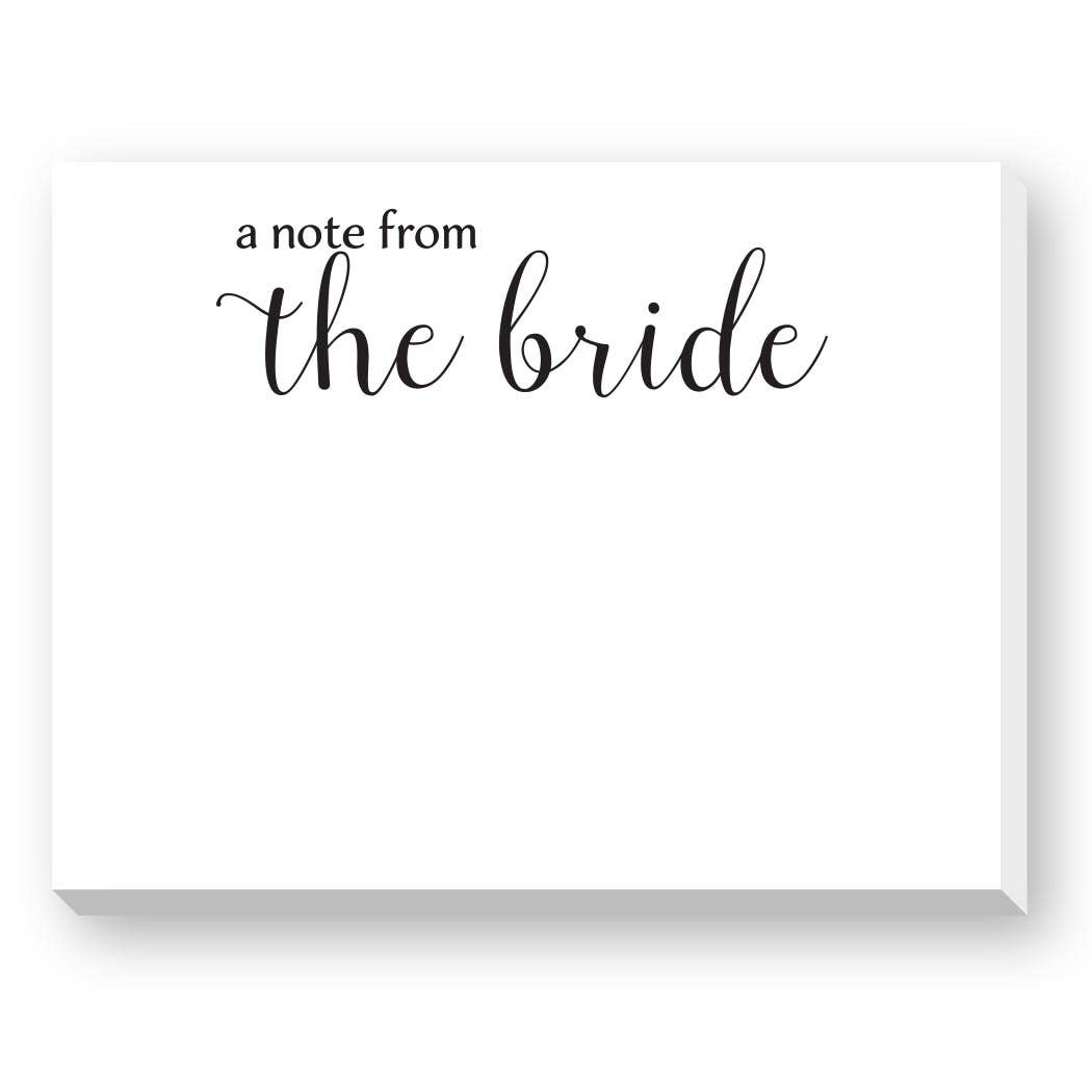 A white rectangular note card with black script text reading 'a note from the bride' on a clean white background.