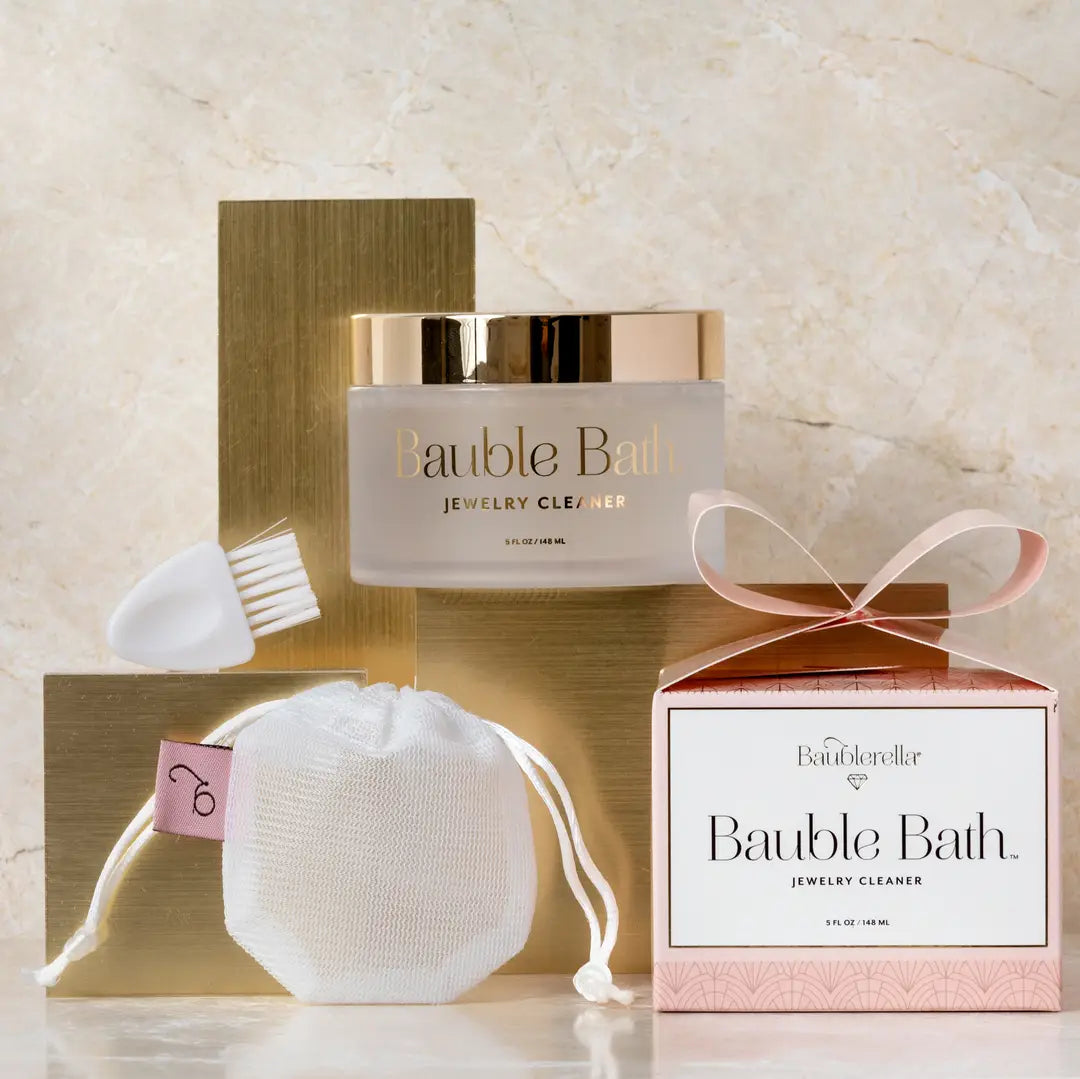 Bauble Bath jewelry cleaner set with packaging on a neutral background