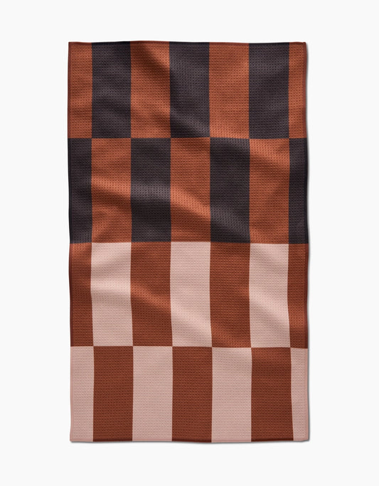 Checkered fabric with brown and black pattern on a white background