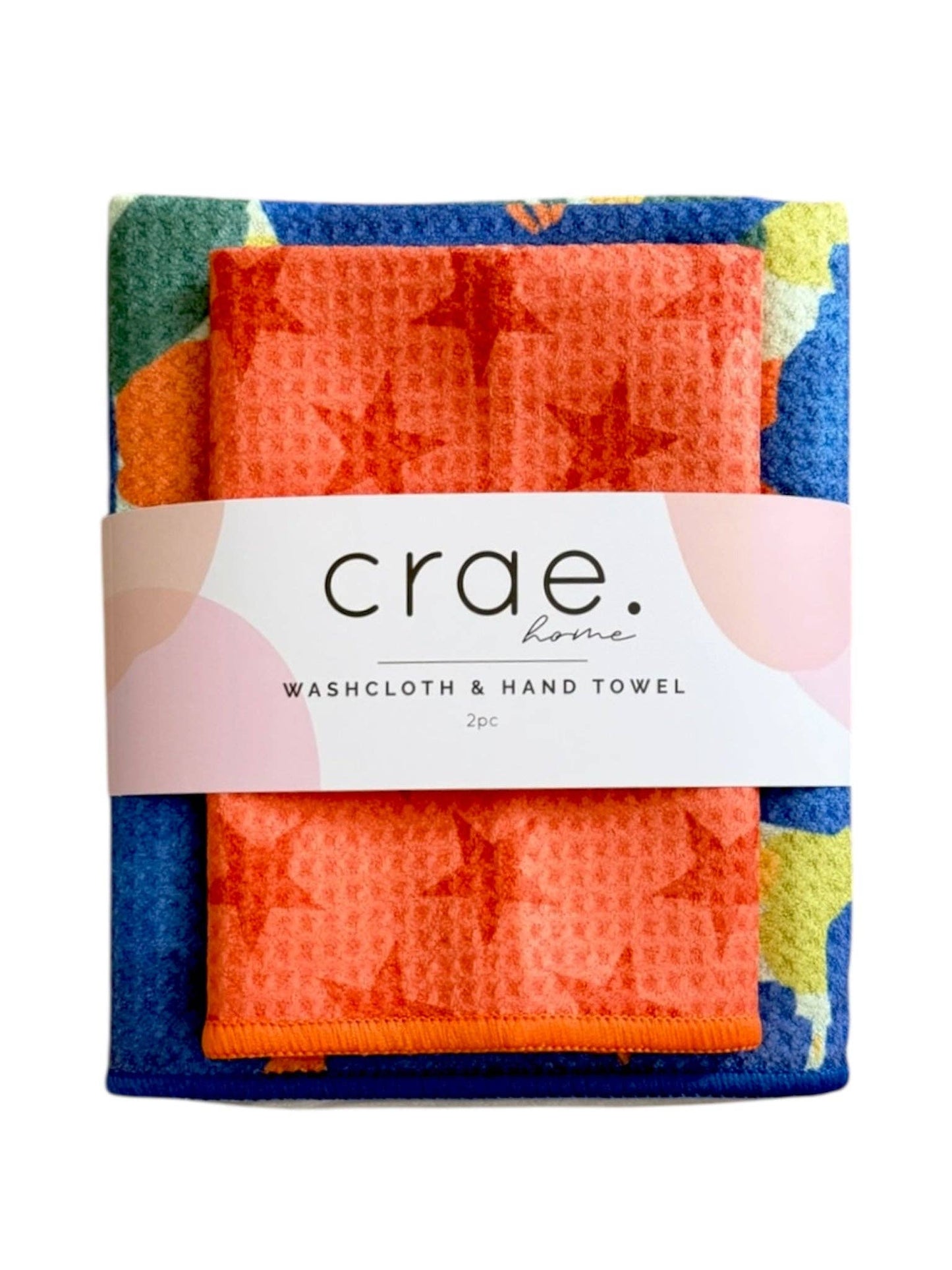 Packaged washcloth and hand towel set with colorful design and 'crae' branding.