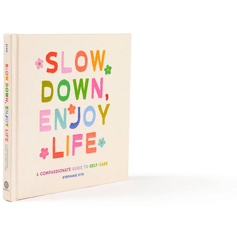 Book titled 'Slow Down, Enjoy Life' with colorful text on a white background