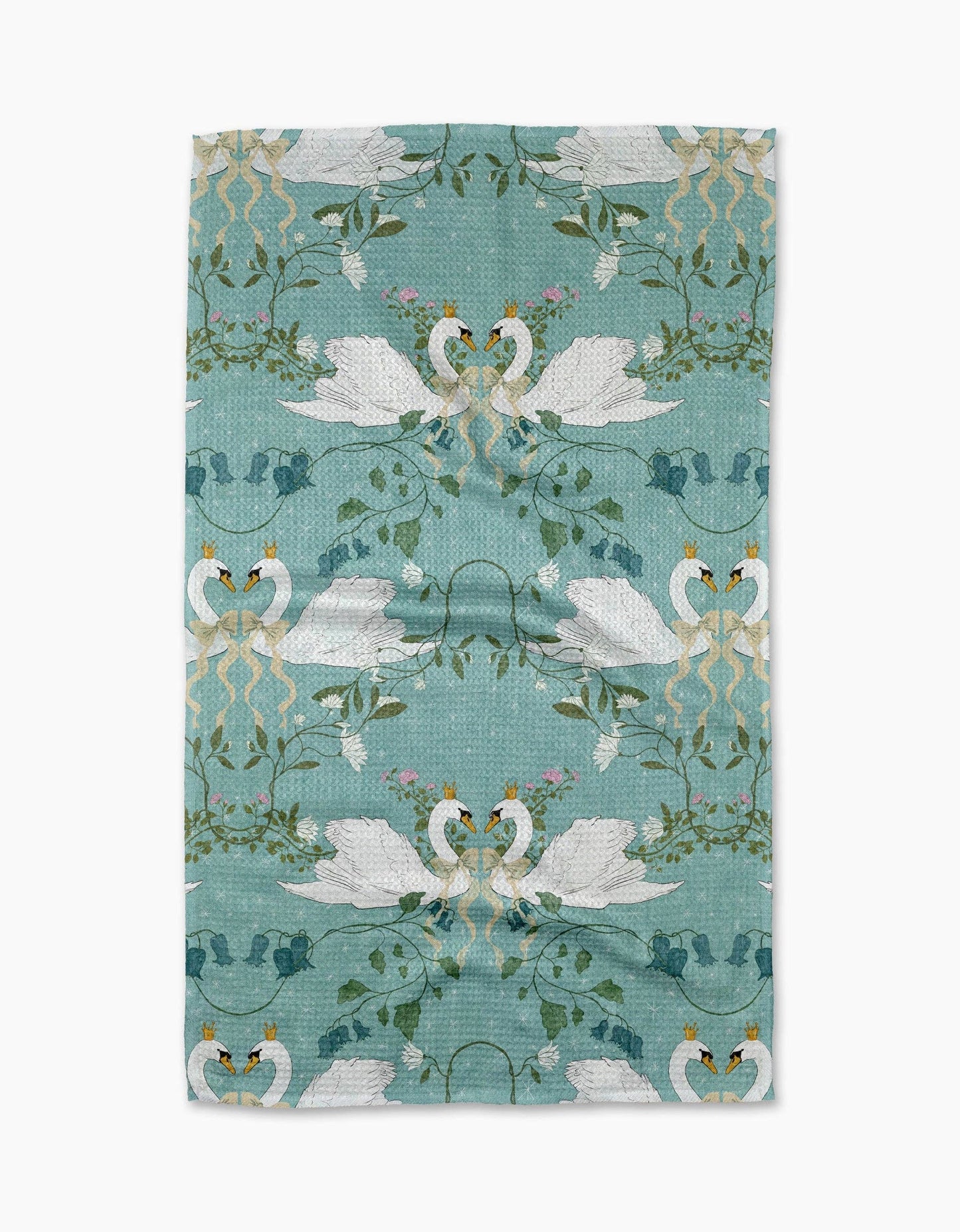 Teal tea towel with a pattern depicting two swans facing each other, surrounded by leaves and flowers, on a white background