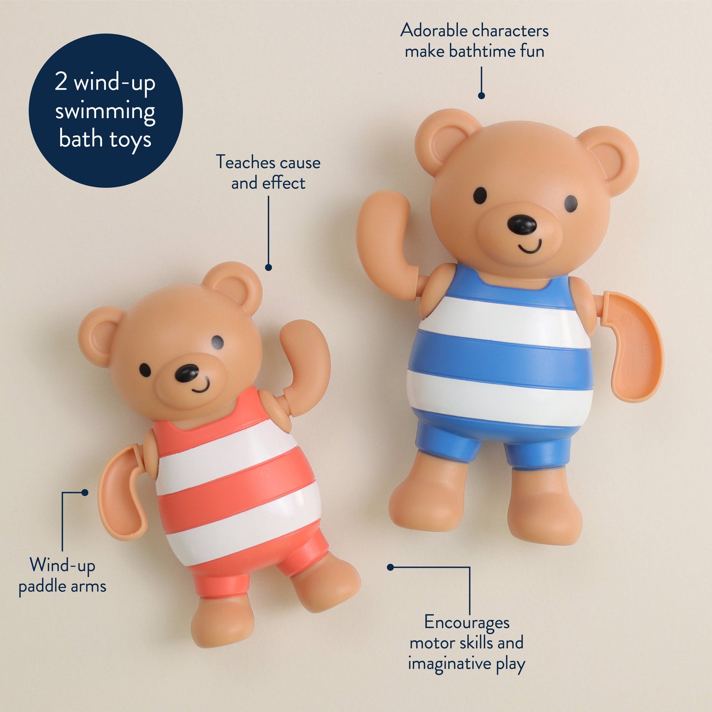 Two wind-up swimming bath toys, one bear in a red and white striped swimsuit and the other in a blue and white striped swimsuit, on a beige background.