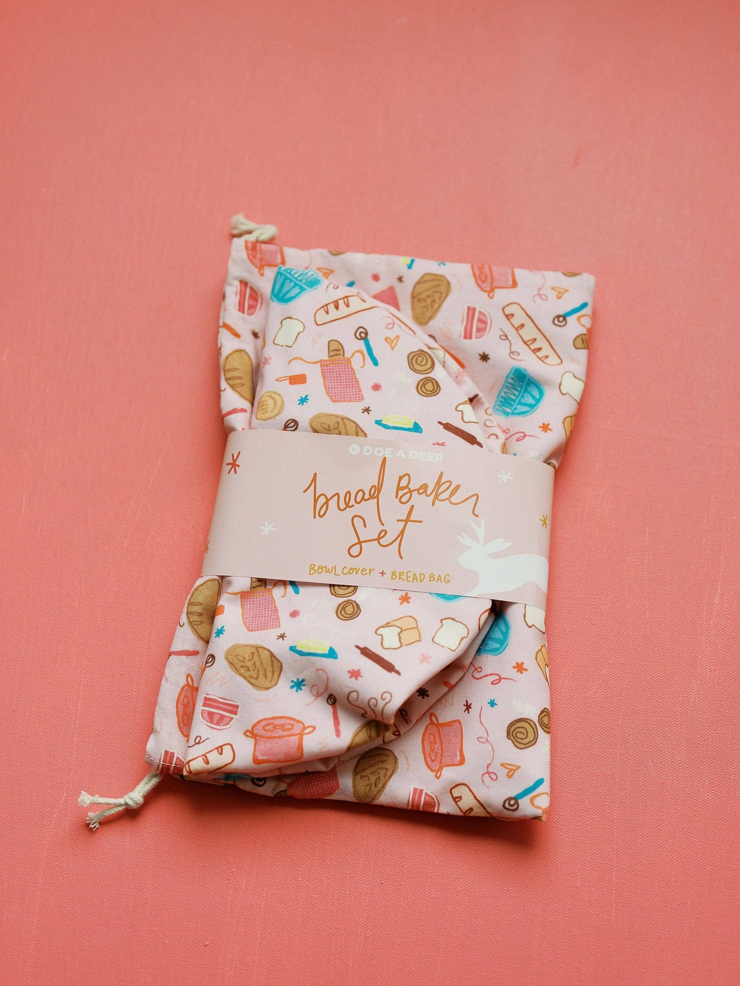 Packaged bread baking set with colorful design on a pink background