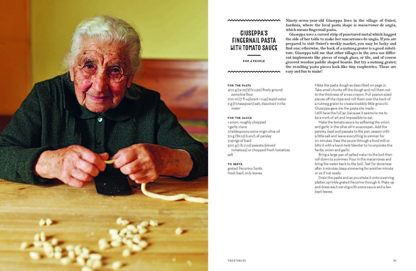 Older woman making pasta with a recipe on the side