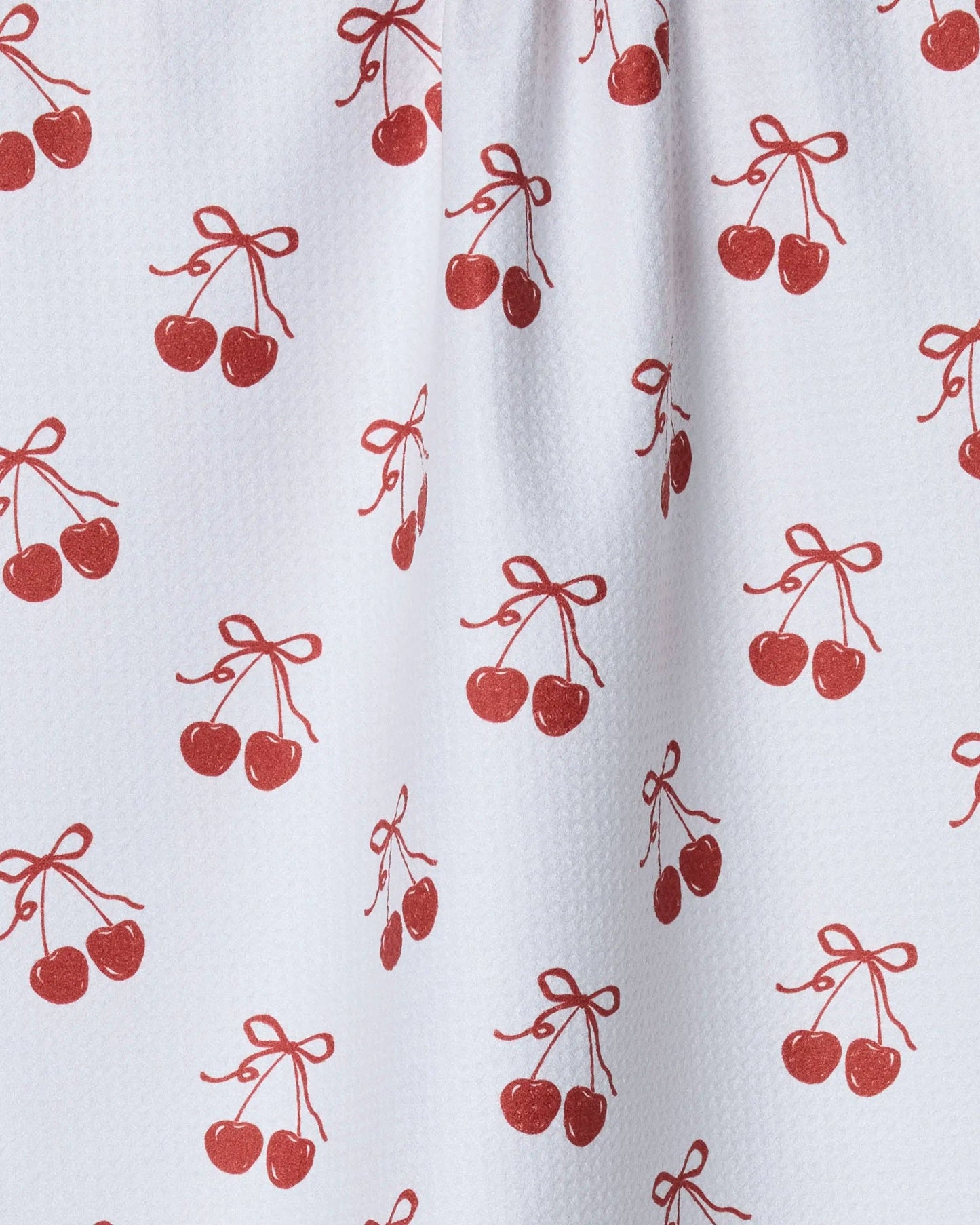 White tea towel with red cherry pattern