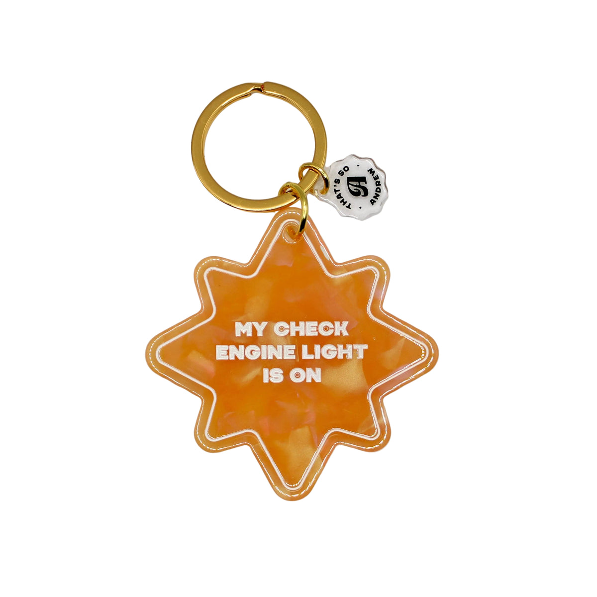 Star-shaped keychain with 'My check engine light is on' text on a beige background
