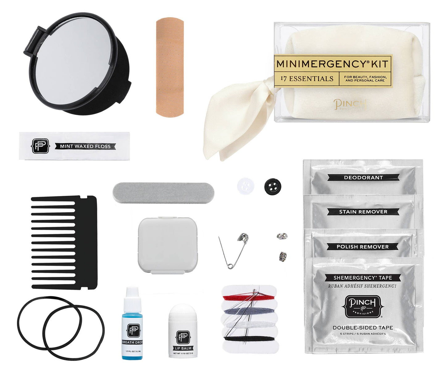 all contents of mini emergency kit layed out on a white background