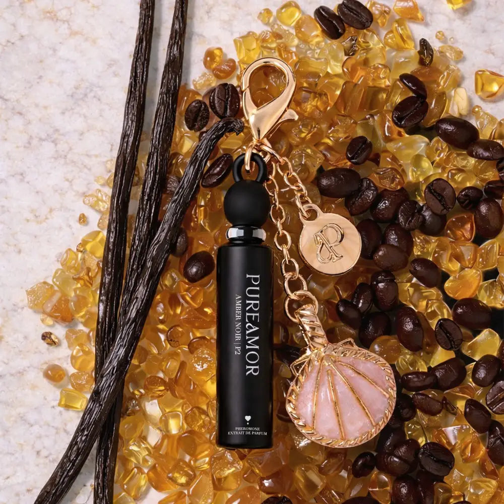 Perfume bottle with decorative elements on a textured surface with coffee beans and vanilla pods.