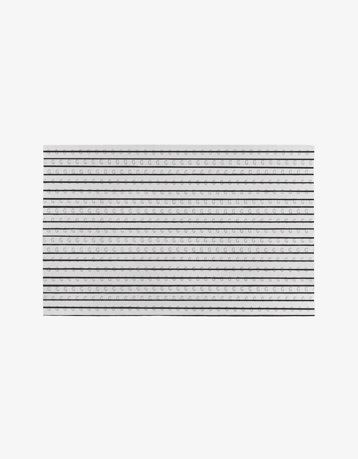 Rectangular black and white striped rug on a white background