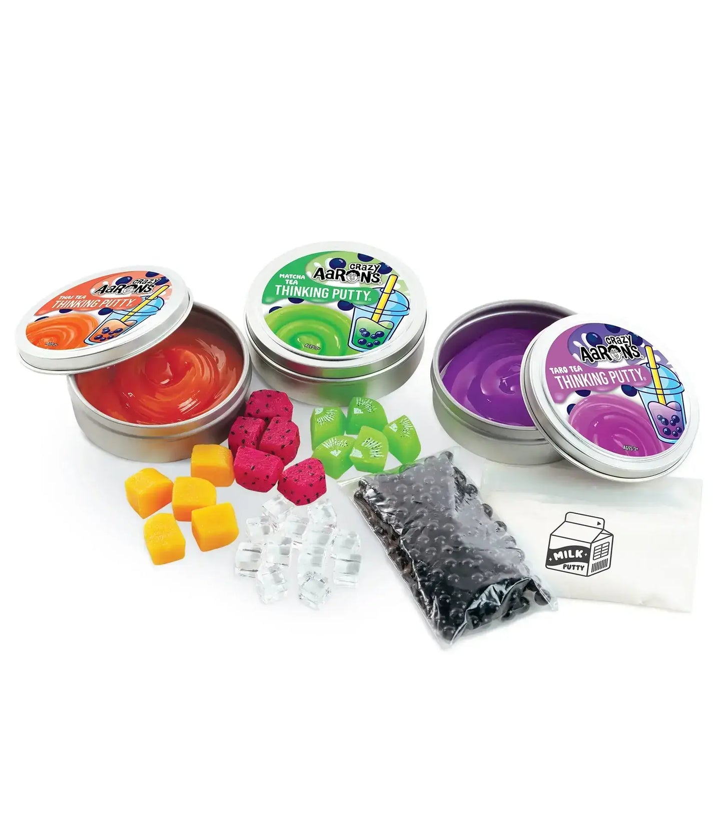 Collection of colorful thinking putty tins and accessories on a white background