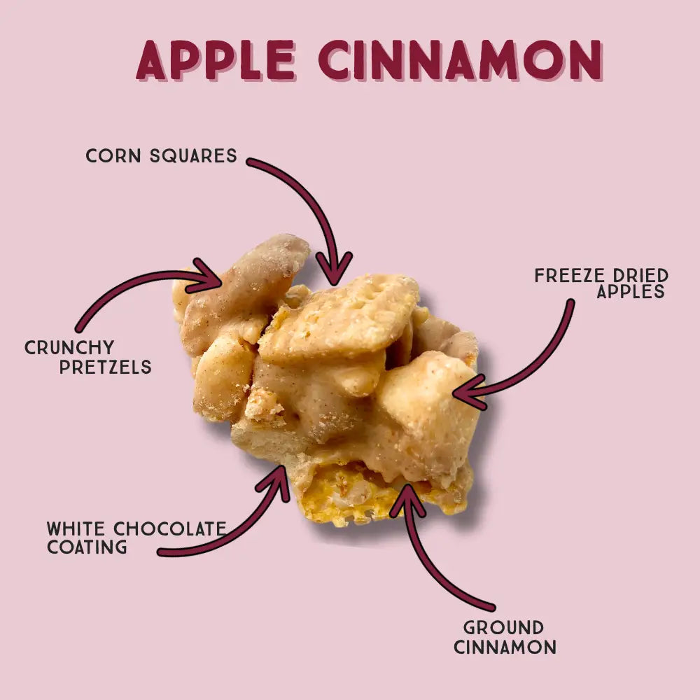 Apple cinnamon snack mix with labeled ingredients on a pink background