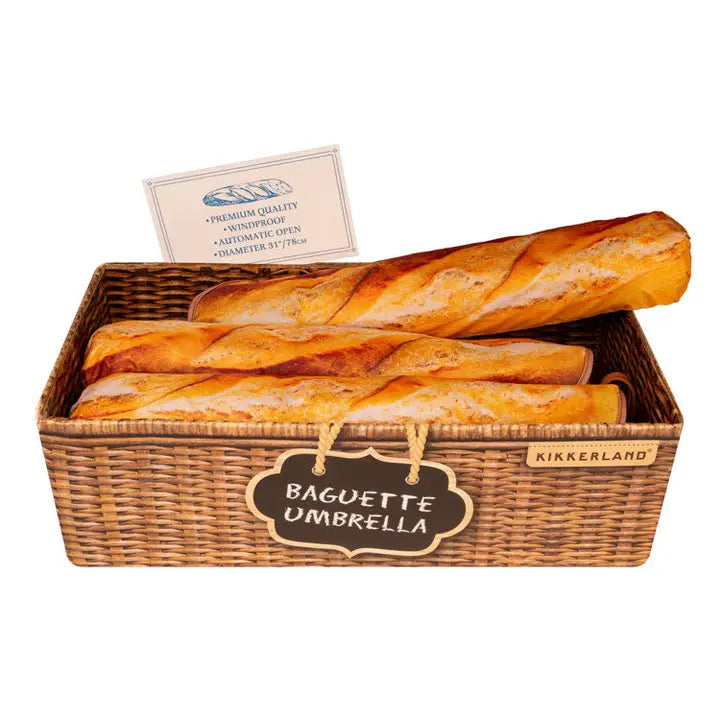 baguette umbrellas in the shop display in a cute basket, further driving home the baguette of bread theme