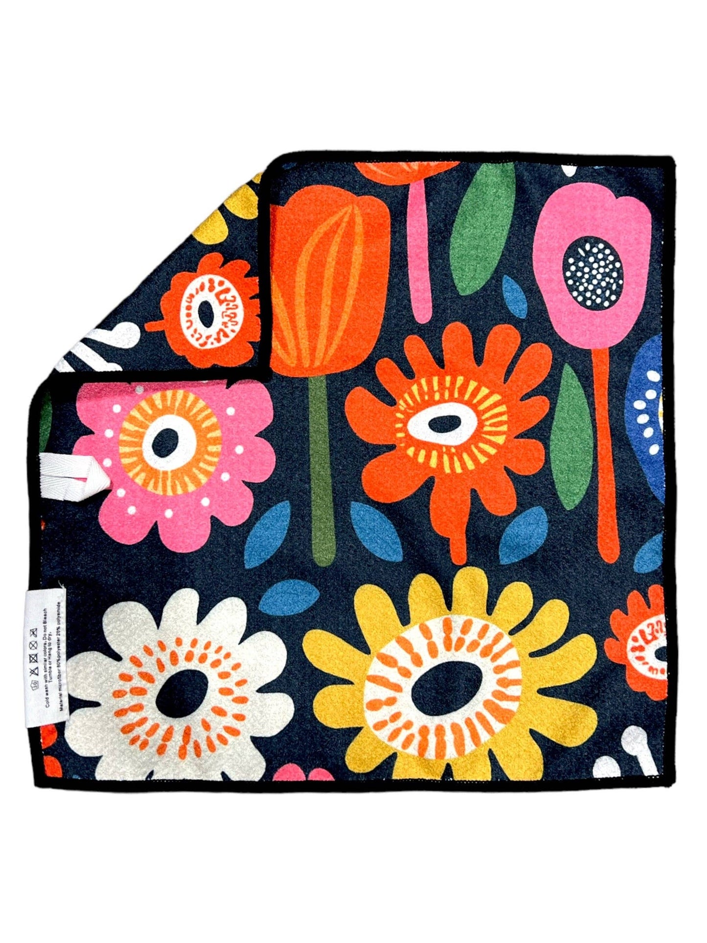 Floral patterned blanket with colorful flowers on a dark background