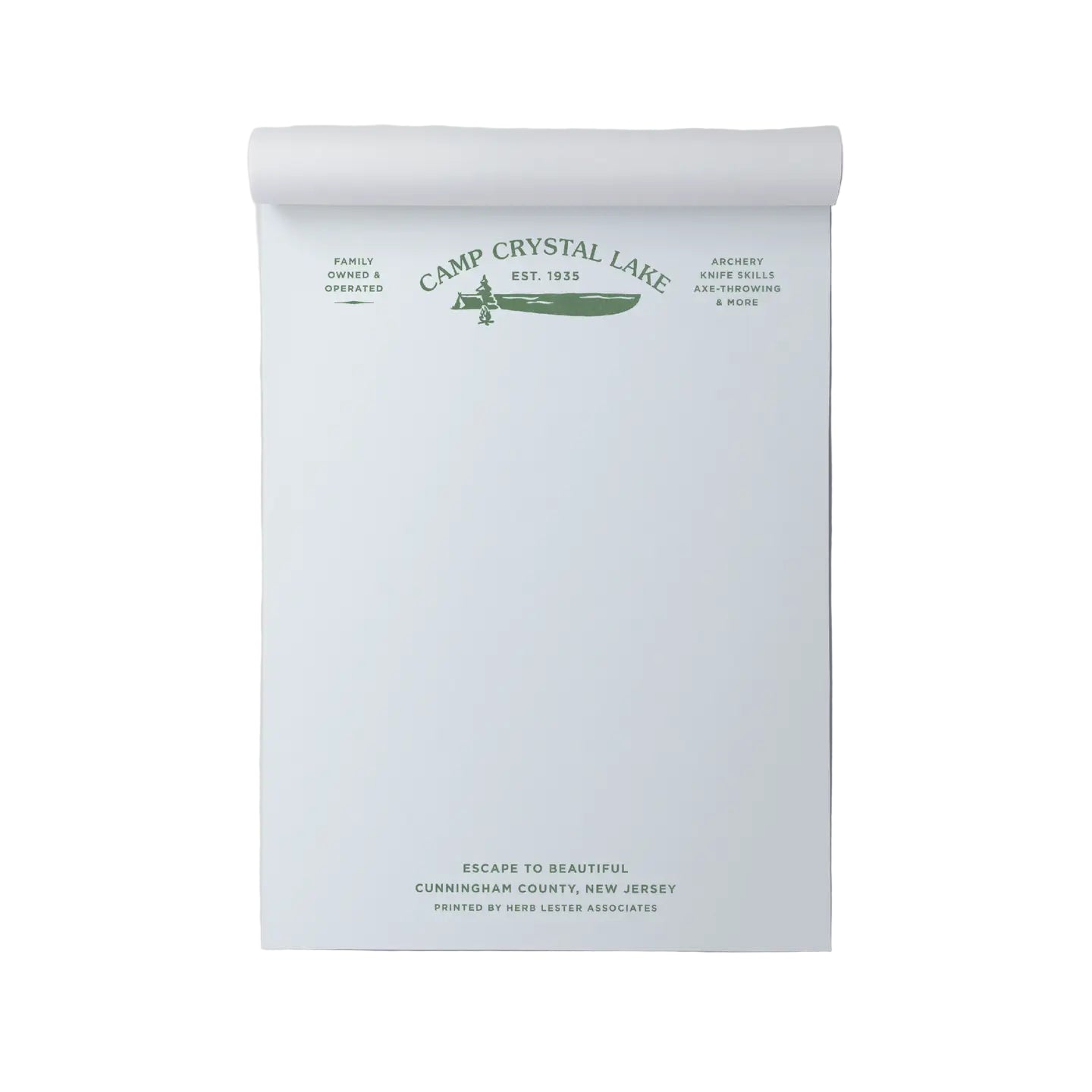 Roll of paper with 'Camp Crystal Lake' branding