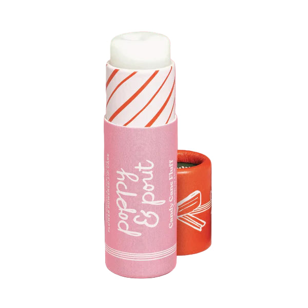Pink lip balm with white and red design on a pink background