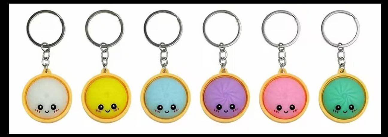 6 color options of a small dumpling keychain against a white background