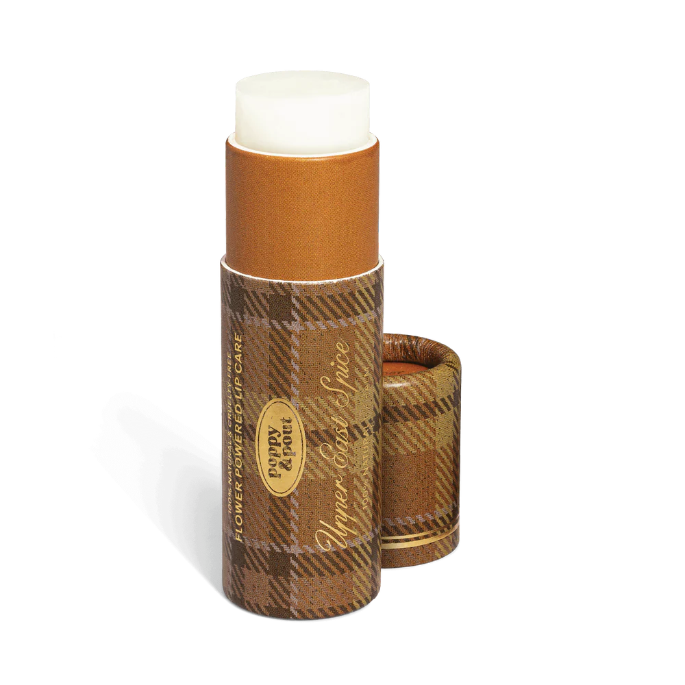 Lip balm with plaid packaging on a white background
