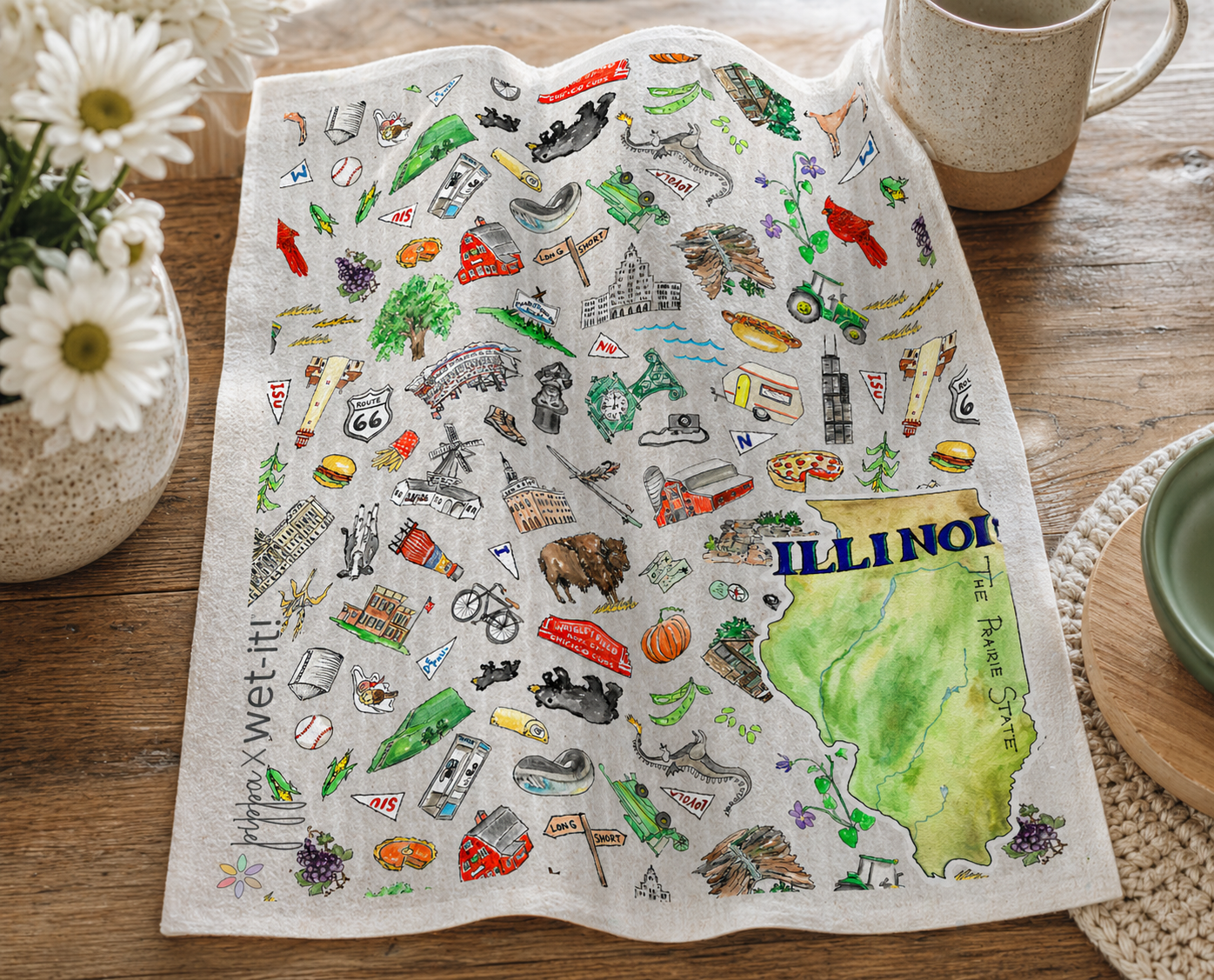 Dish towel with Illinois map and icons on a wooden table