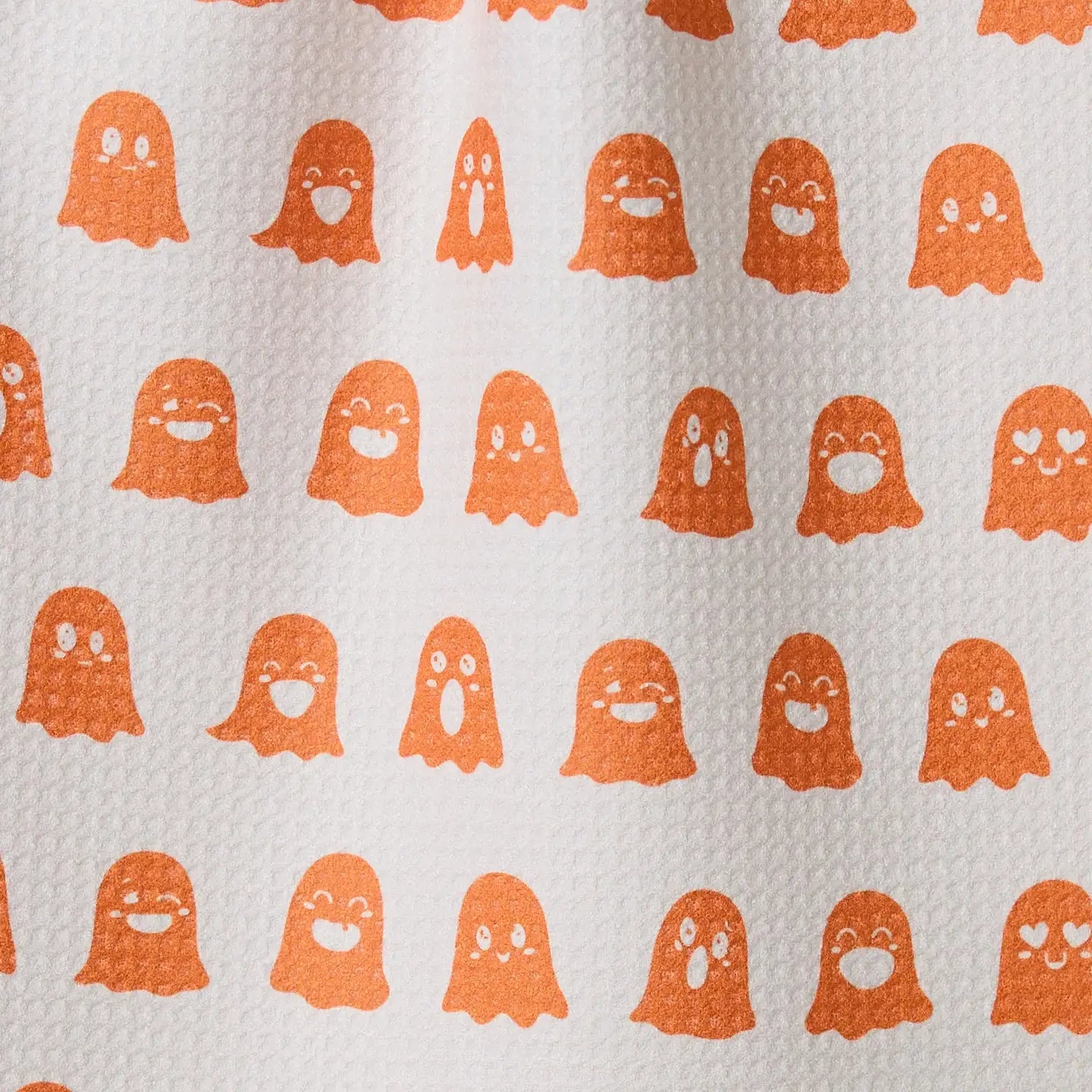 Pattern of orange ghosts on a white background