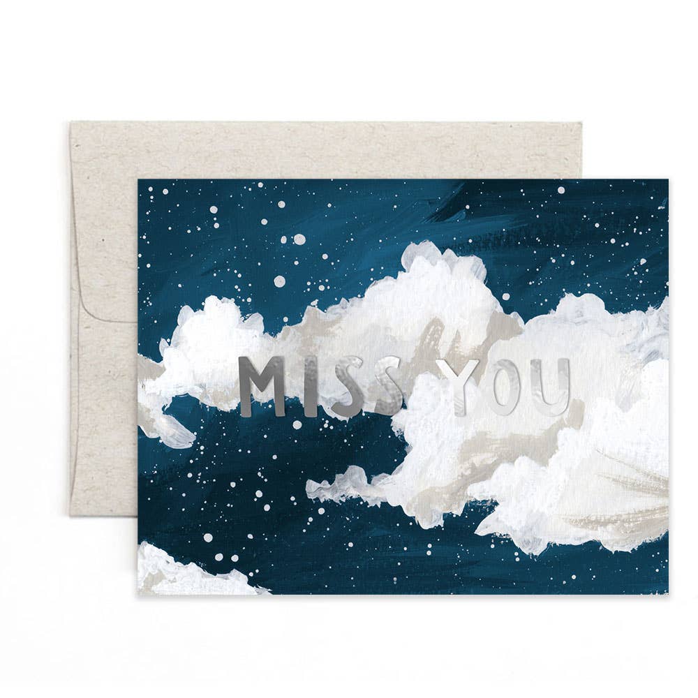 Greeting card with 'Miss You' text on a cloud design, accompanied by an envelope.