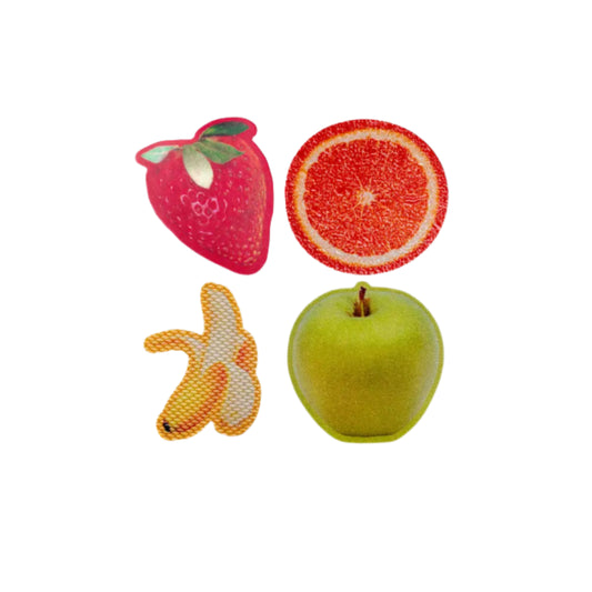 Fruit-shaped stickers on a white background (strawberry, orange, banana, green apple)