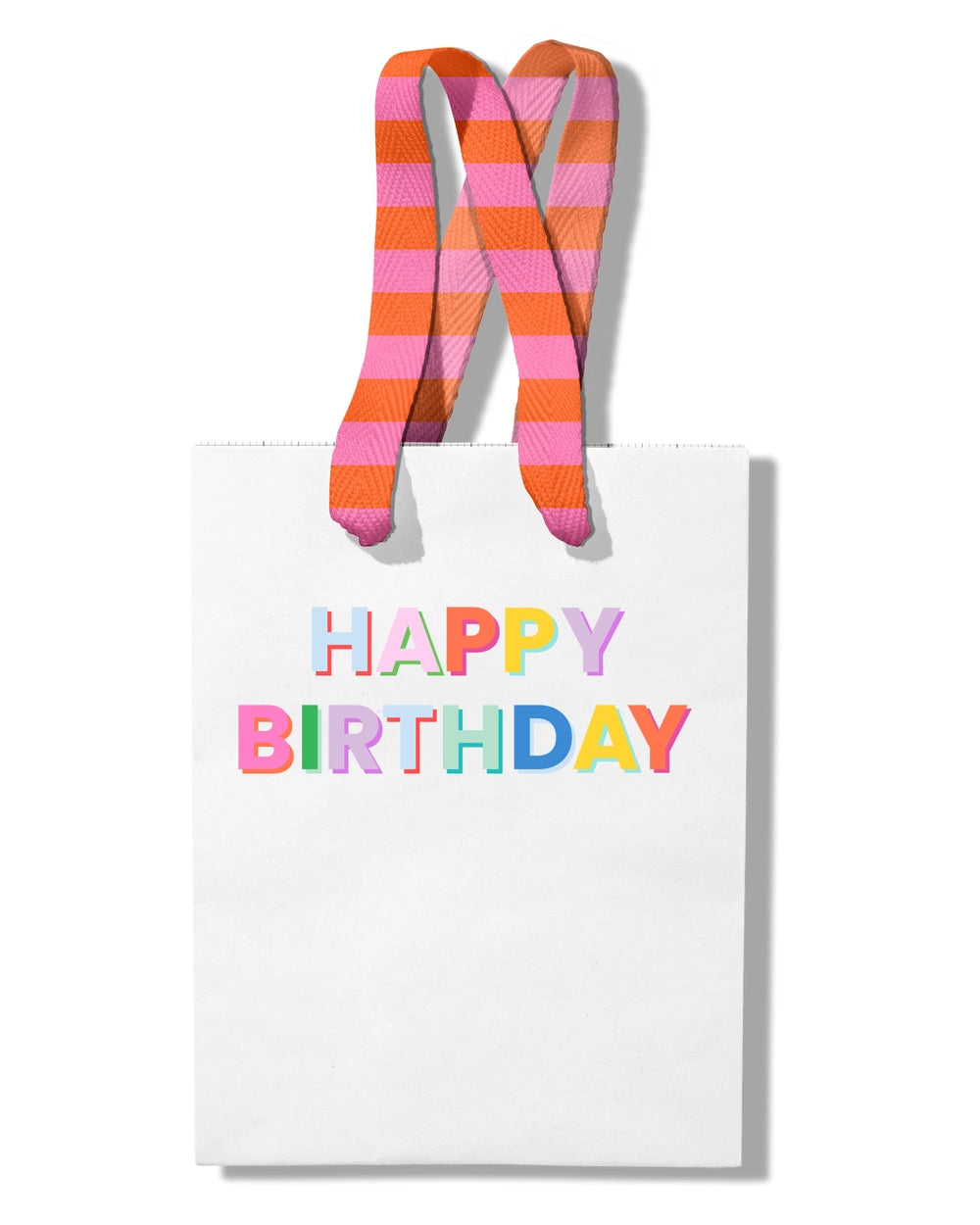 A white gift bag with 'HAPPY BIRTHDAY' text in colorful letters at the top, featuring orange and pink striped ribbon handles.