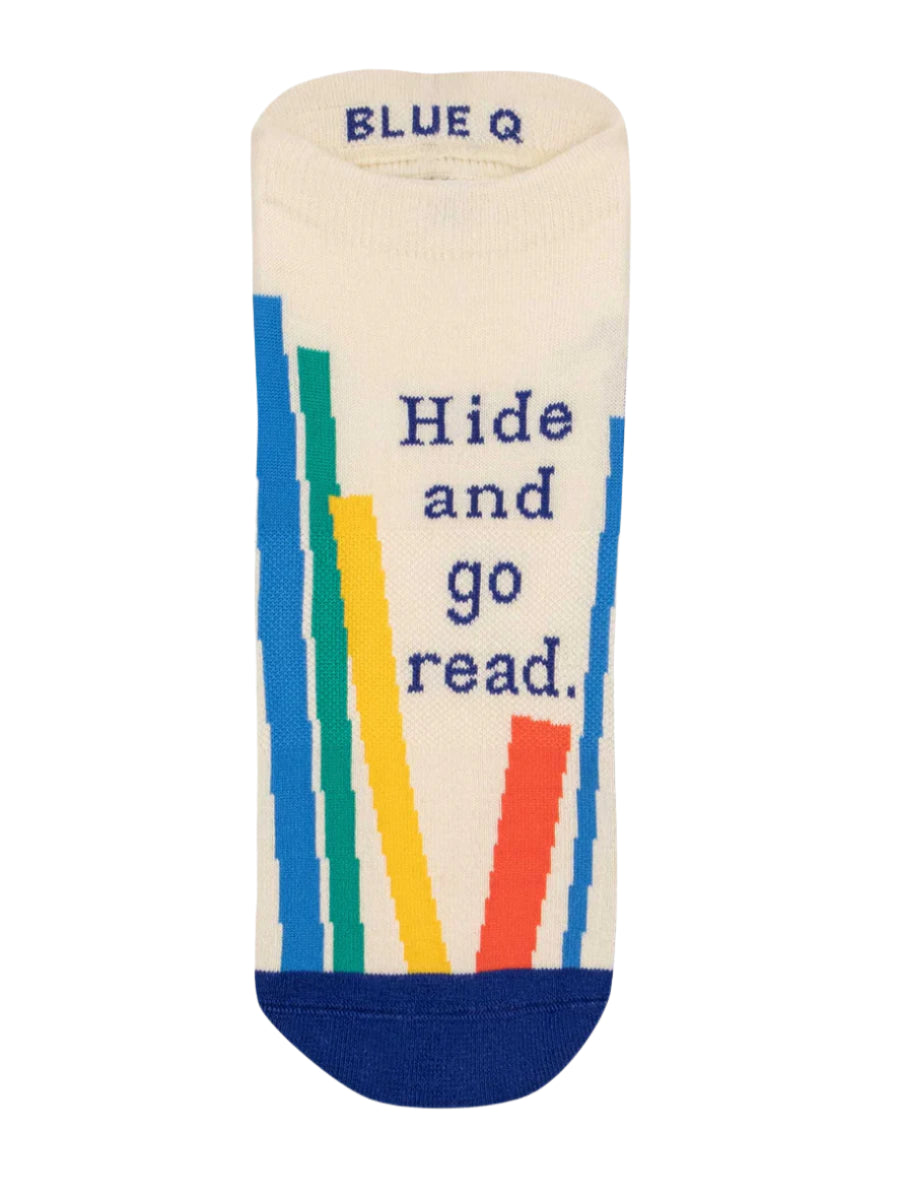 Beige sock with colorful book illustrations and 'Hide and go read' text on a white background