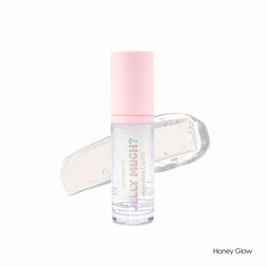 The Honey Glow color of Jelly Much lip oil is shown (it is clear),along with the packaging which is a tube with wand and pink lid.