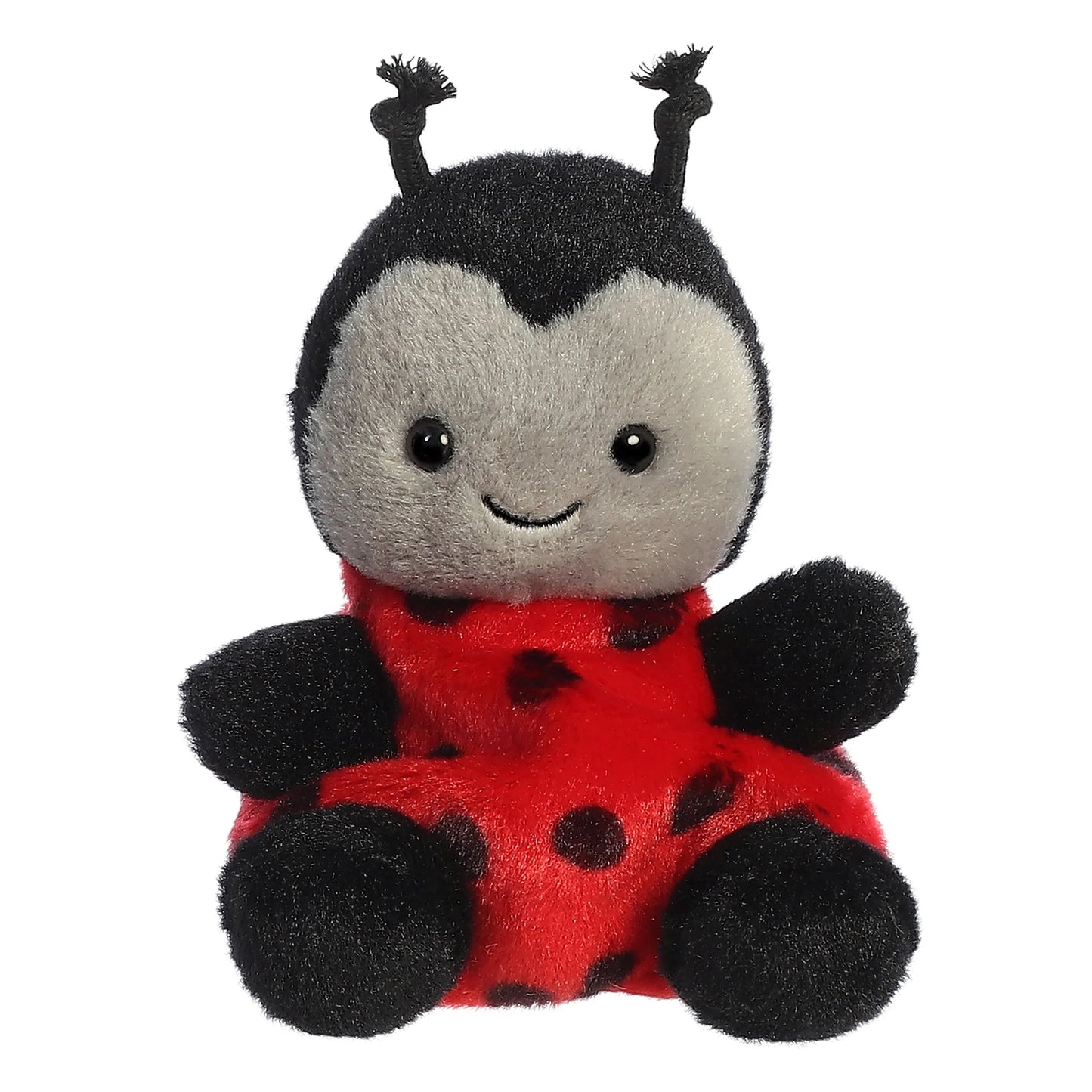 Plush toy ladybug with a red body and black spots on a white background