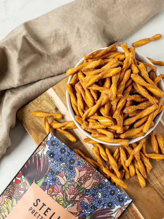Stellar Pretzels in a bowl,showing the seasoning on each pretzel stick.