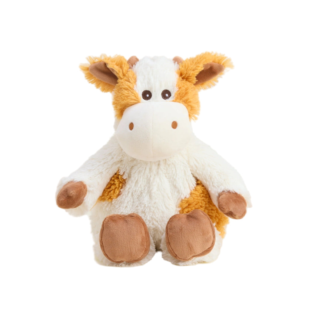 Plush cow toy on a white background