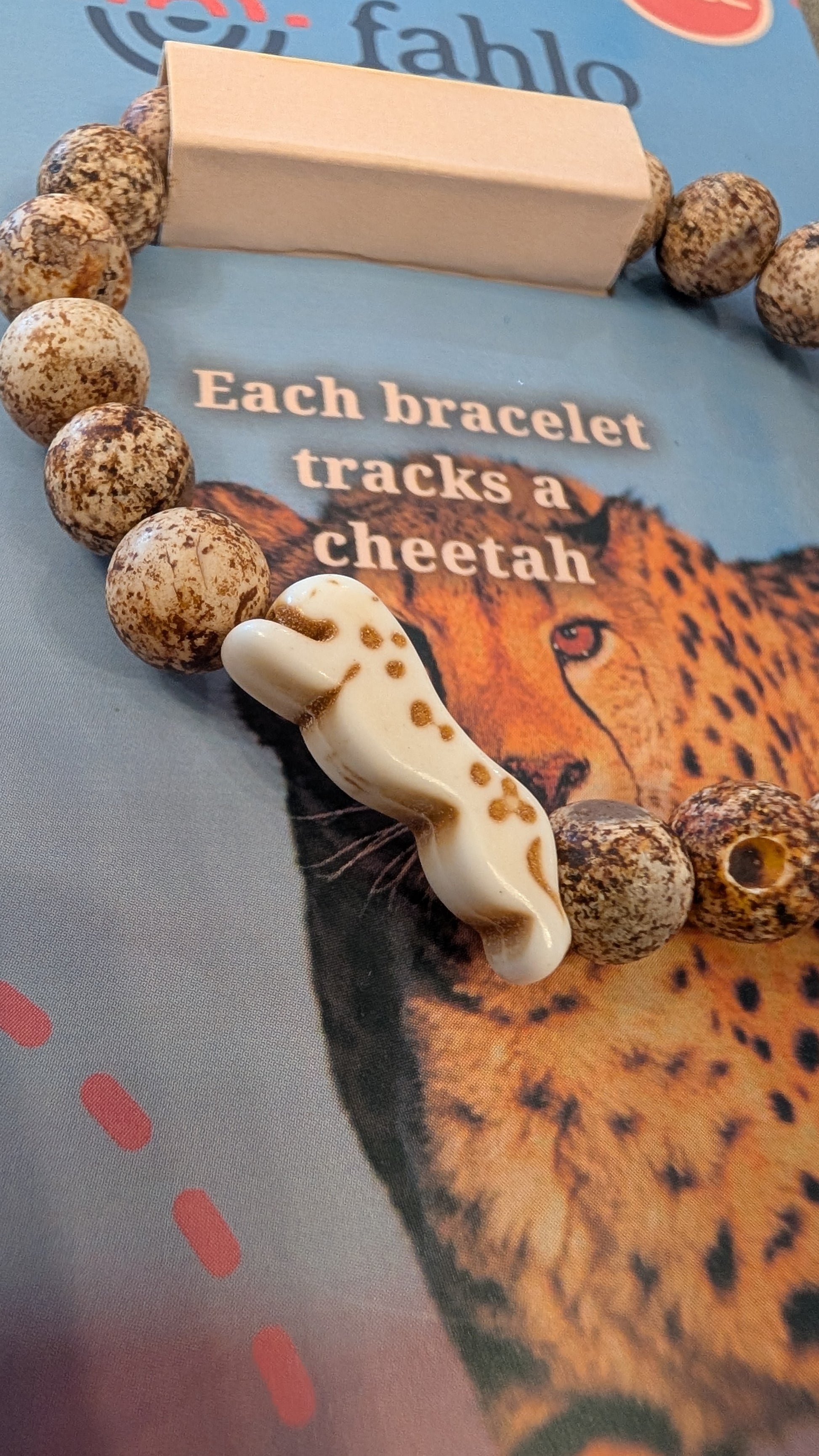 Bracelet with cheetah design on a background with cheetah illustration