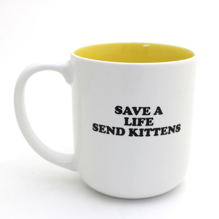 yellow and white mug that says save a life send kittens on the back. On the front is says cats make me feel less murdery
