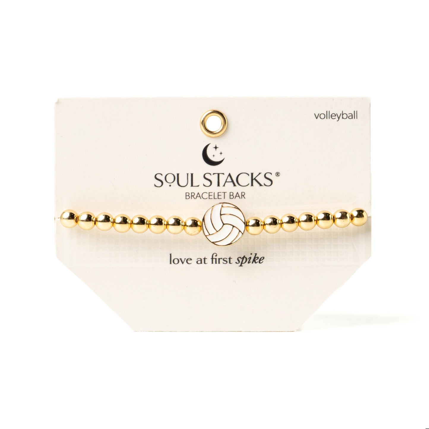 Soul stacks gold beaded bracelet with a volleyball charm on card packaging with text that reads "Love at first spike"