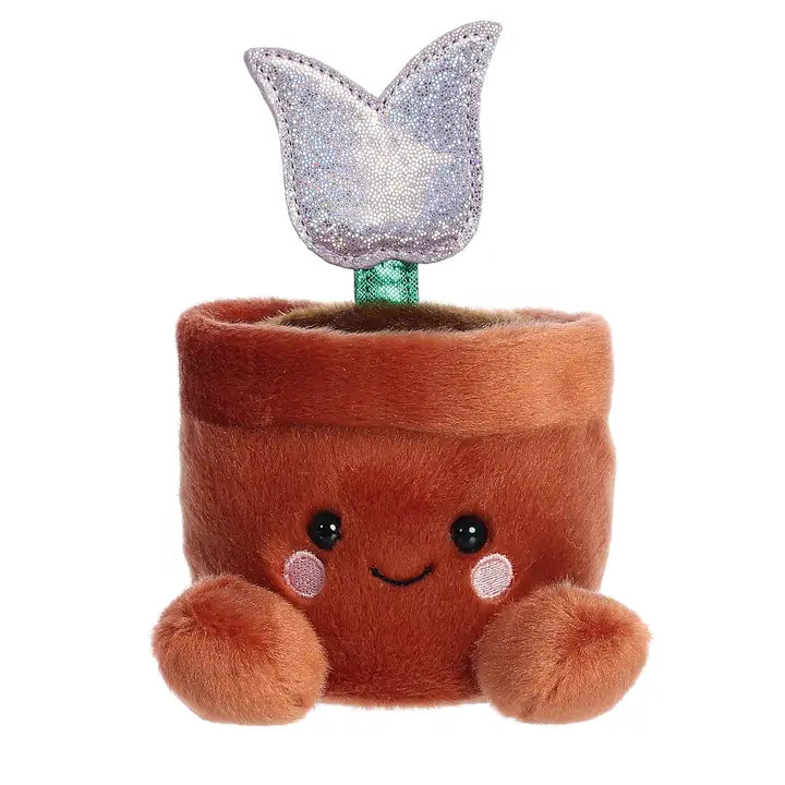 Plush toy resembling a potted plant with a smiling face and glittery top