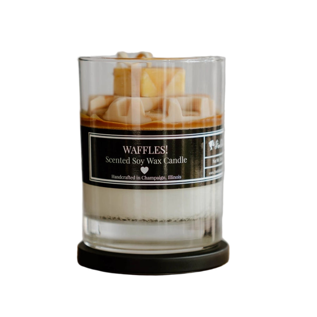 Scented soy wax candle with waffle design in a glass container on a white background