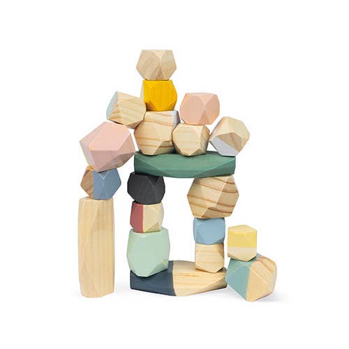 Colorful wooden building blocks stacked on a white background