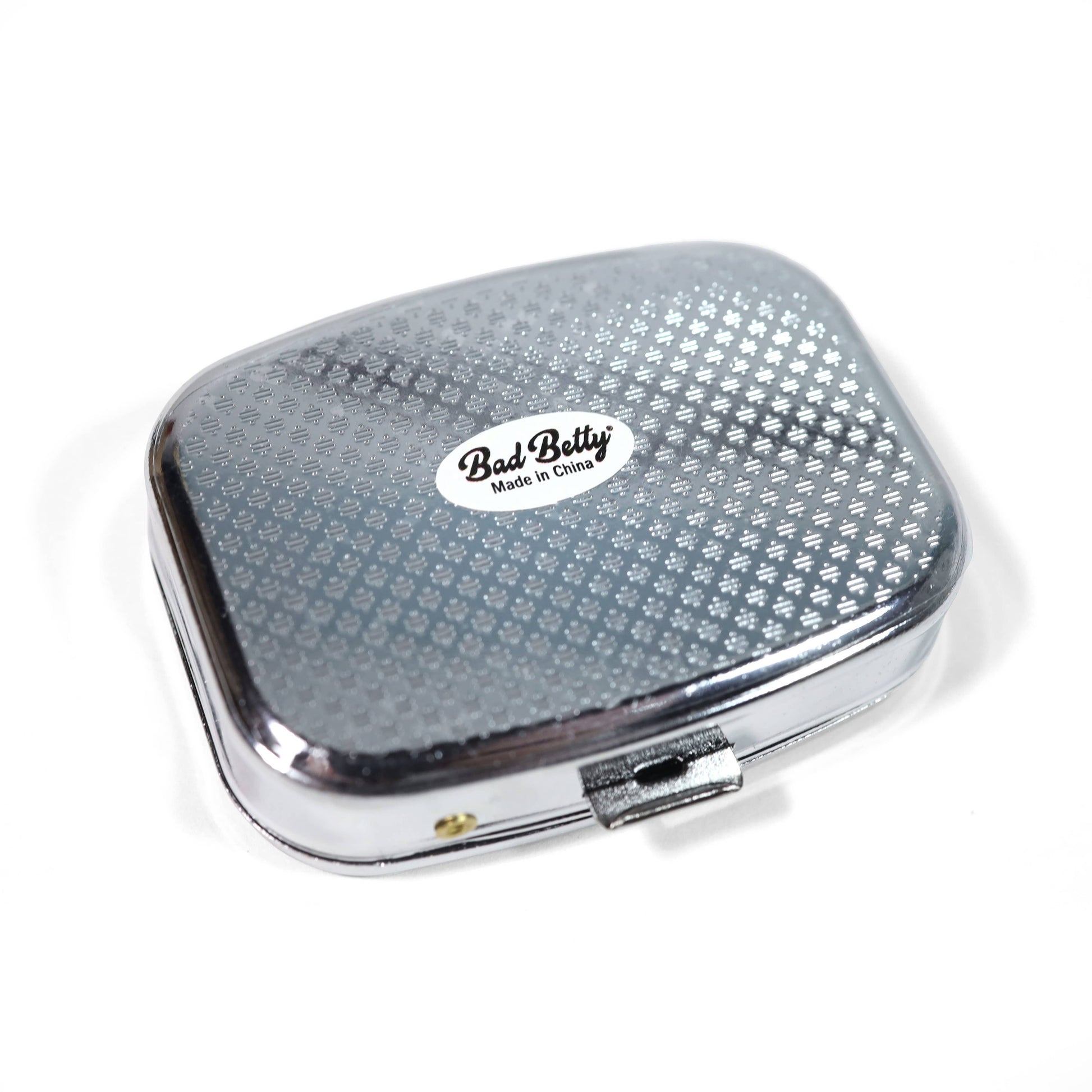 Silver rectangular compact with 'Bad Betty' branding on a white background