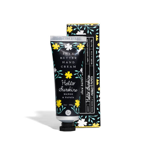 Shea butter hand cream with floral design packaging on a white background