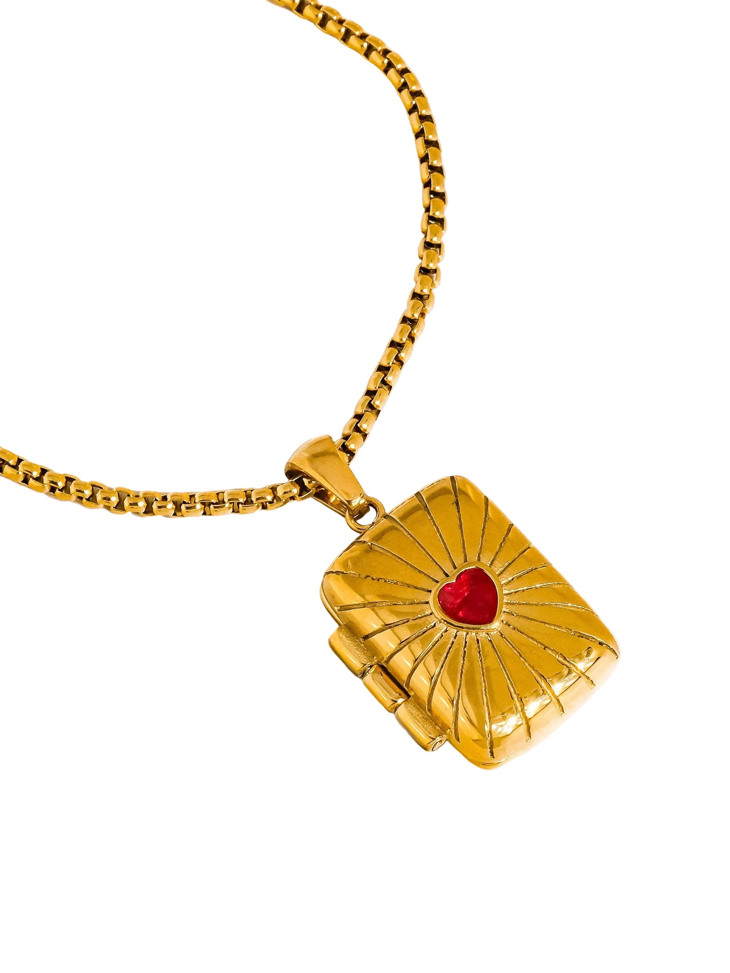 Gold necklace with a sun-shaped pendant featuring a red heart on a white background
