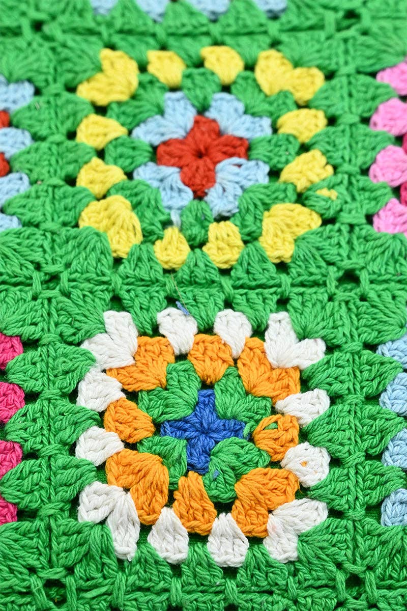 Colorful crocheted blanket with a circular pattern