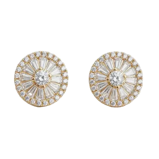 Gold and crystal stud earrings on a light background