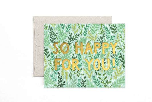 Greeting card with 'So Happy For You!' text on a green leaf patterned background