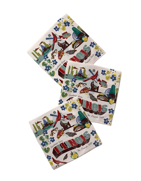 Four colorful coasters with 'Illinois' design on a marble surface
