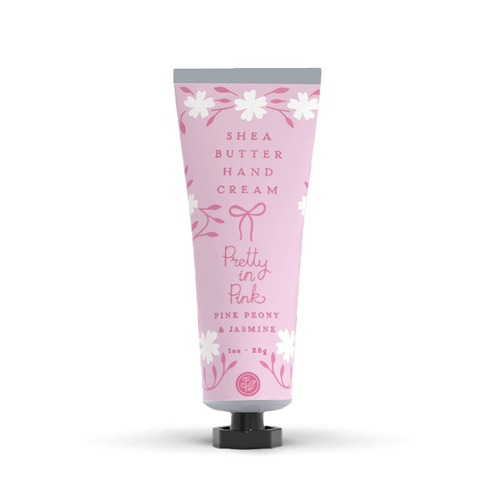 Shea butter hand cream tube with pink floral design on a white background