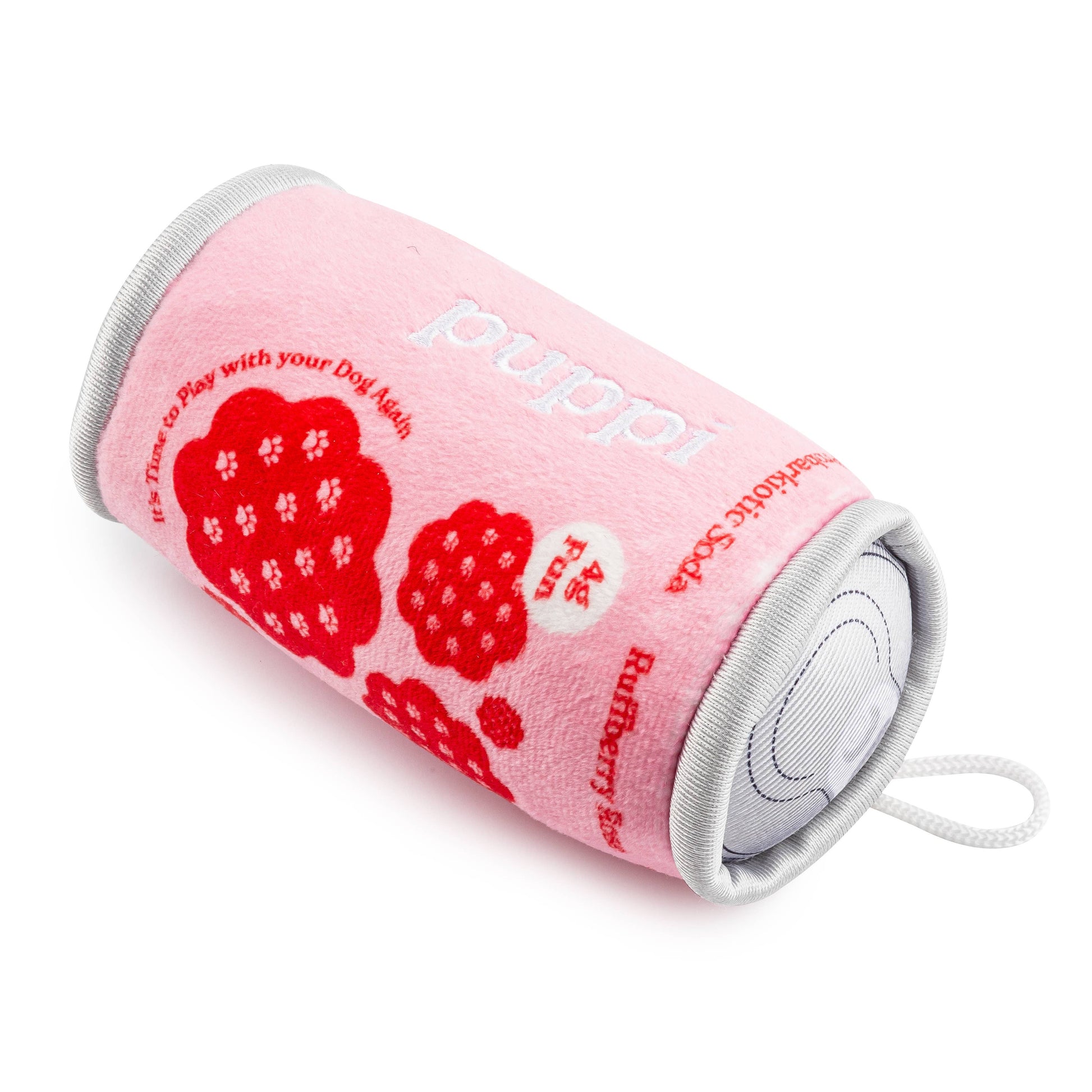 Pink cylindrical dog toy with red paw prints and 'Puppi' text on a white background