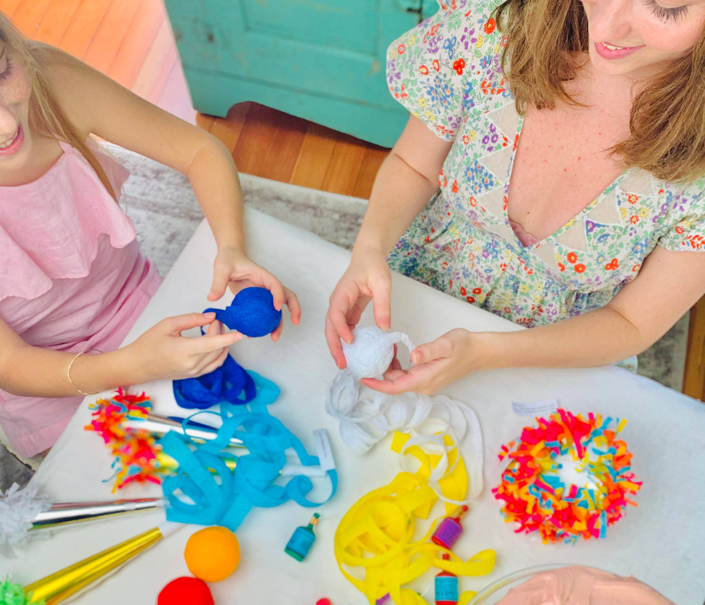 Two children playing with colorful toys on a table.